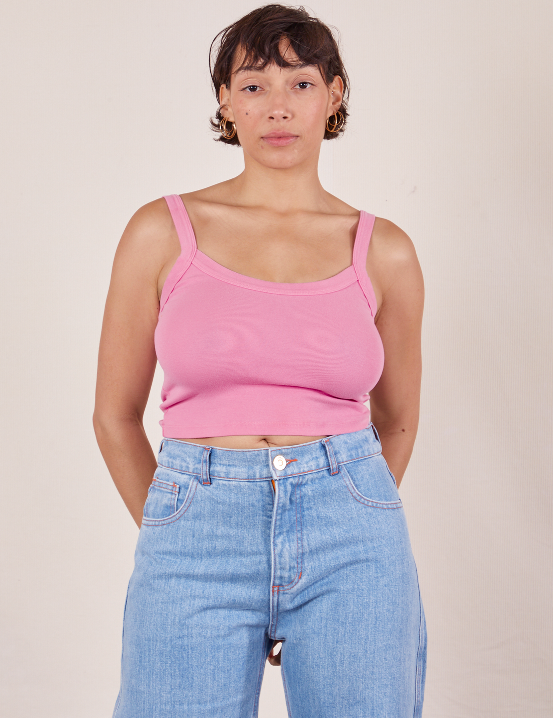 Tiara is wearing Cropped Cami in Bubblegum Pink and light wash Sailor Jeans