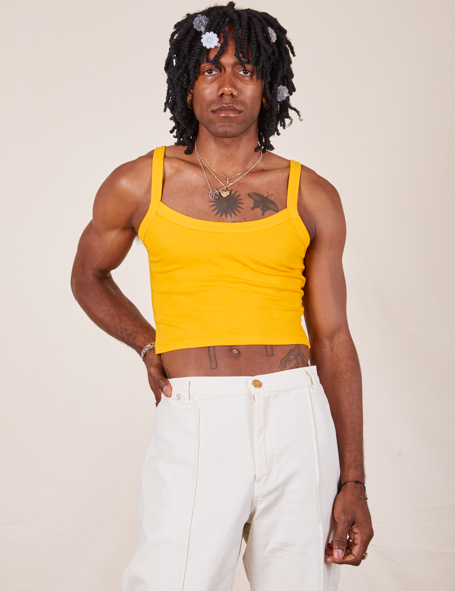Jerrod is wearing Cropped Cami in Sunshine Yellow and vintage off-white Western Pants