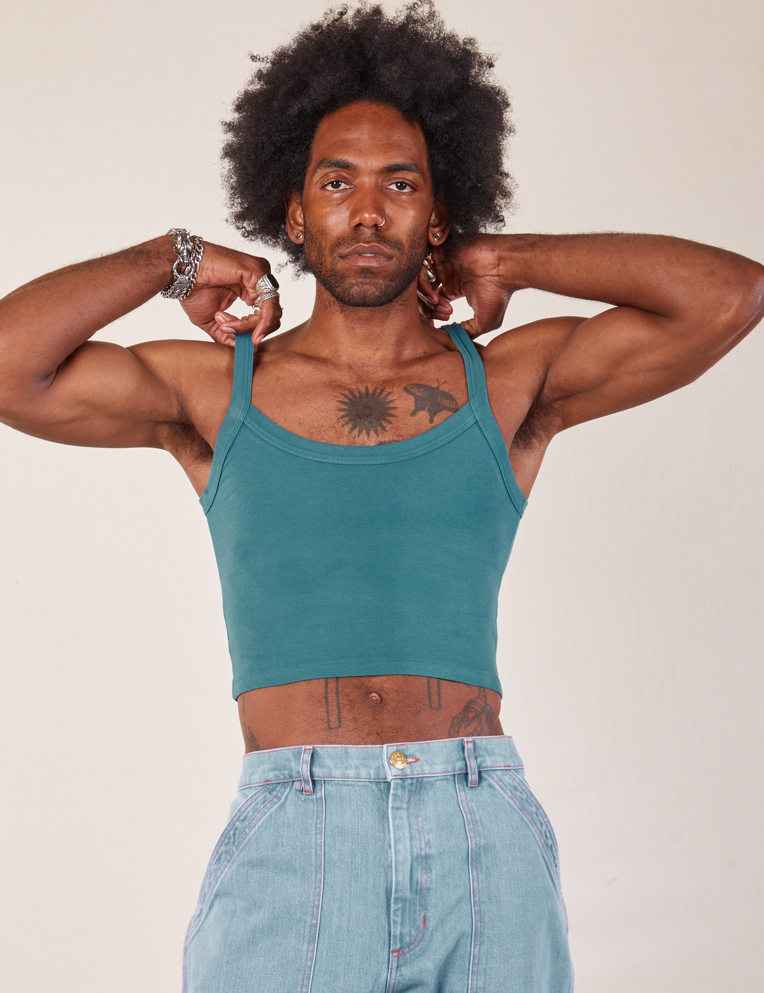 Jerrod is 6’3” and wearing S Cropped Cami in Marine Blue