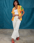 Kandia is wearing Gummy Bear Pantry Button-Up and Western Pants in Vintage Tee Off-White
