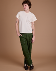 Quinn is wearing Carpenter Jeans in Evergreen and the Organic Vintage Tee in Vintage Tee Off-White