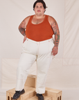 Sam is 5'10" and wearing 3XL Carpenter Jeans in Vintage Off-White paired with burnt terracotta Cropped Tank Top