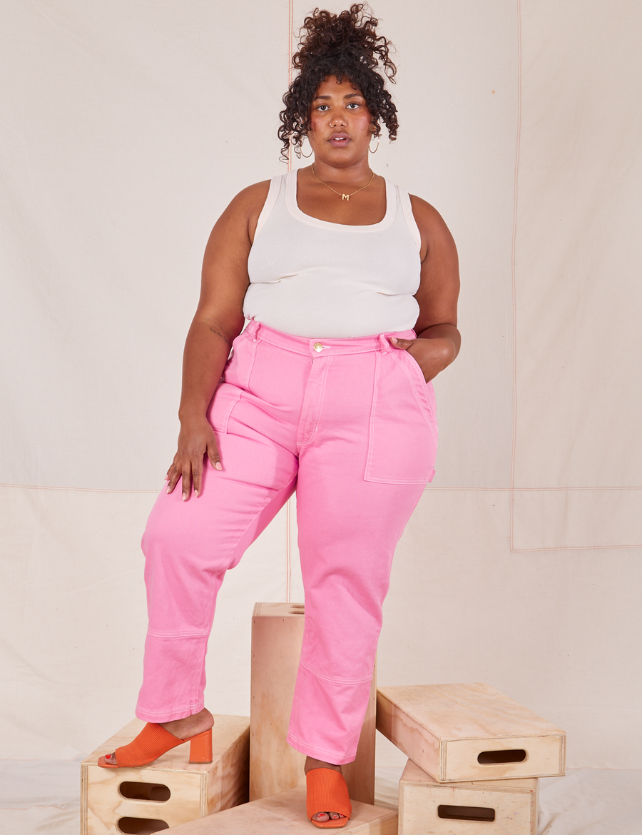 Morgan is wearing Carpenter Jeans in Bubblegum Pink and vintage off-white Tank Top
