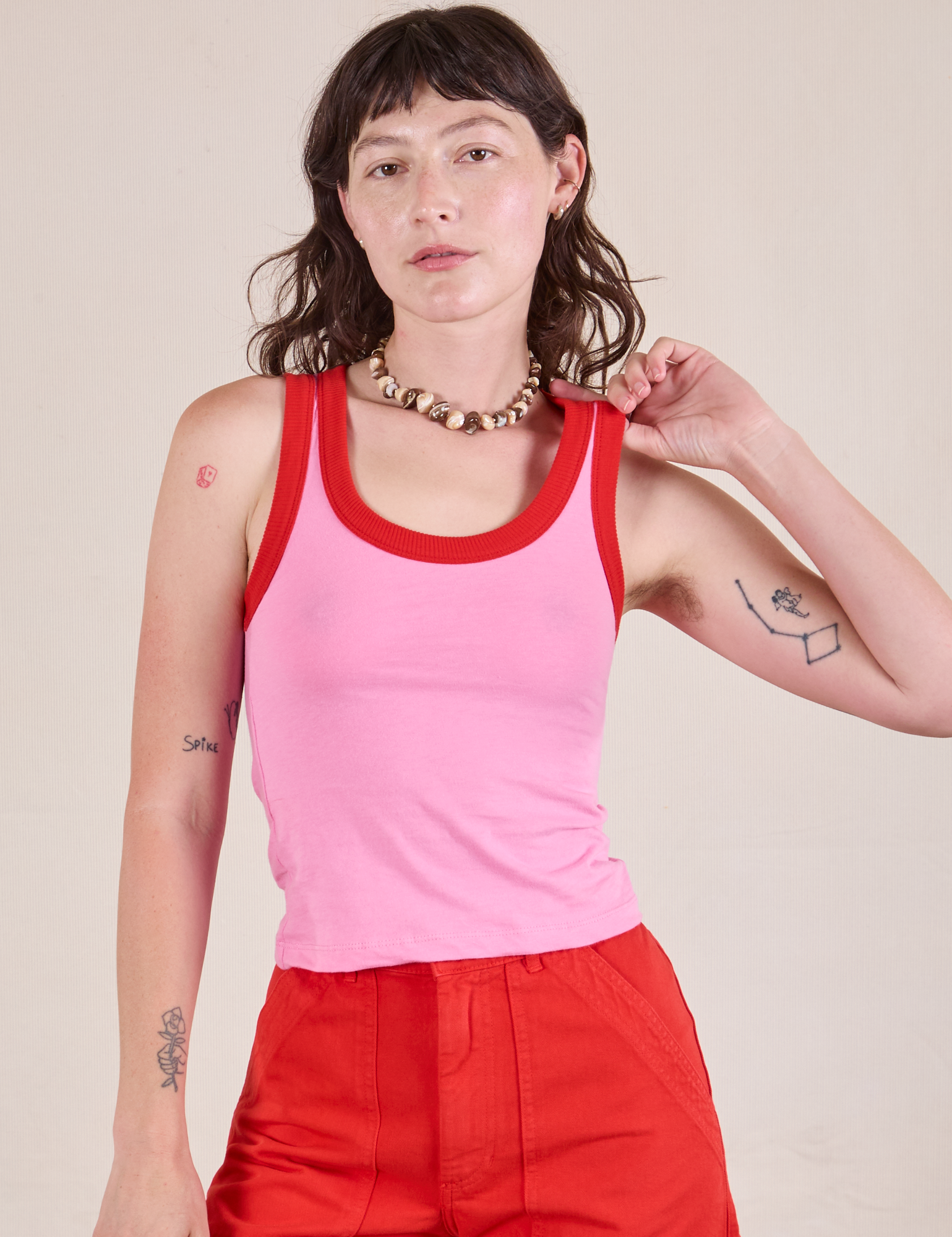 Alex is 5'8" and wearing P Colorblock Cropped Tank in Bubblegum Pink