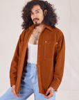 Jesse is 5'8" and wearing XS Corduroy Overshirt in Burnt Terracotta paired with vintage off-white Cropped Tank and light wash Trouser Jeans