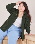 Ashley is wearing Corduroy Overshirt in Swamp Green and light wash Denim Trouser Jeans