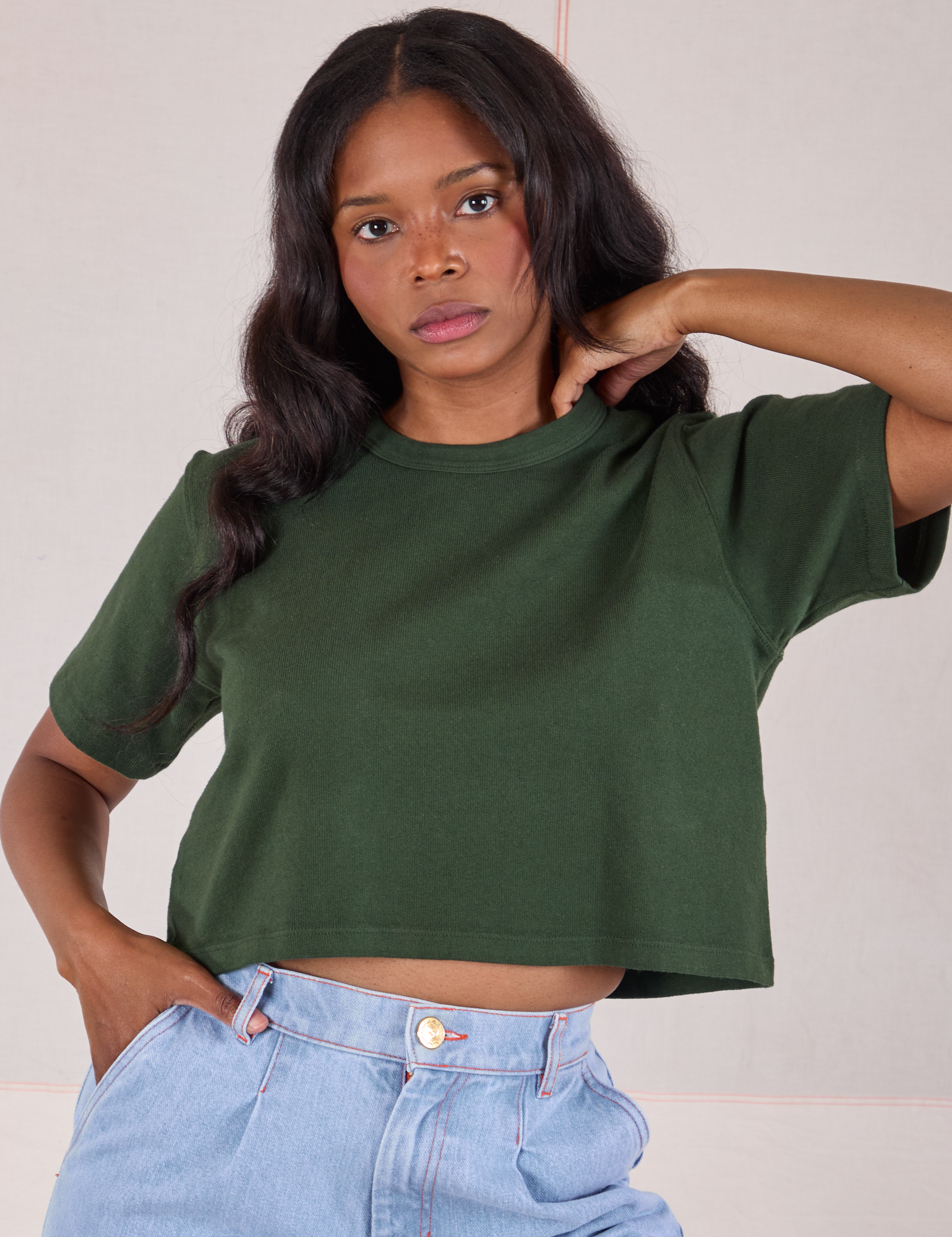 Kandia is 5'3" and wearing P Cropped Burly Tee in Swamp Green