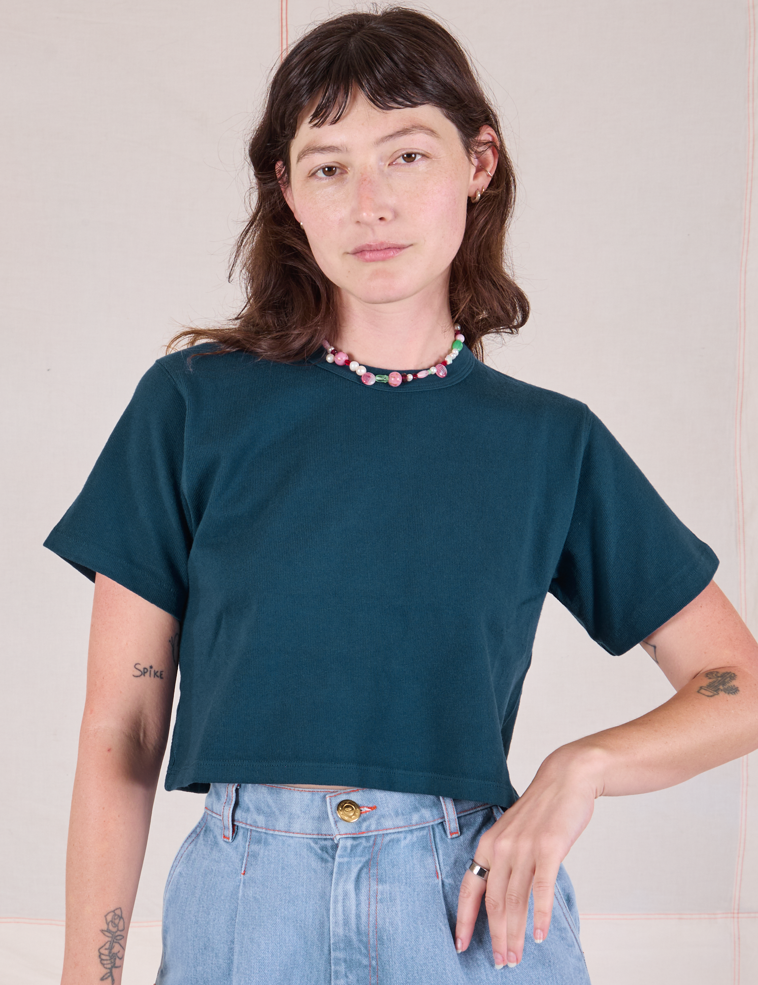 Alex is wearing Cropped Burly Tee in Lagoon
