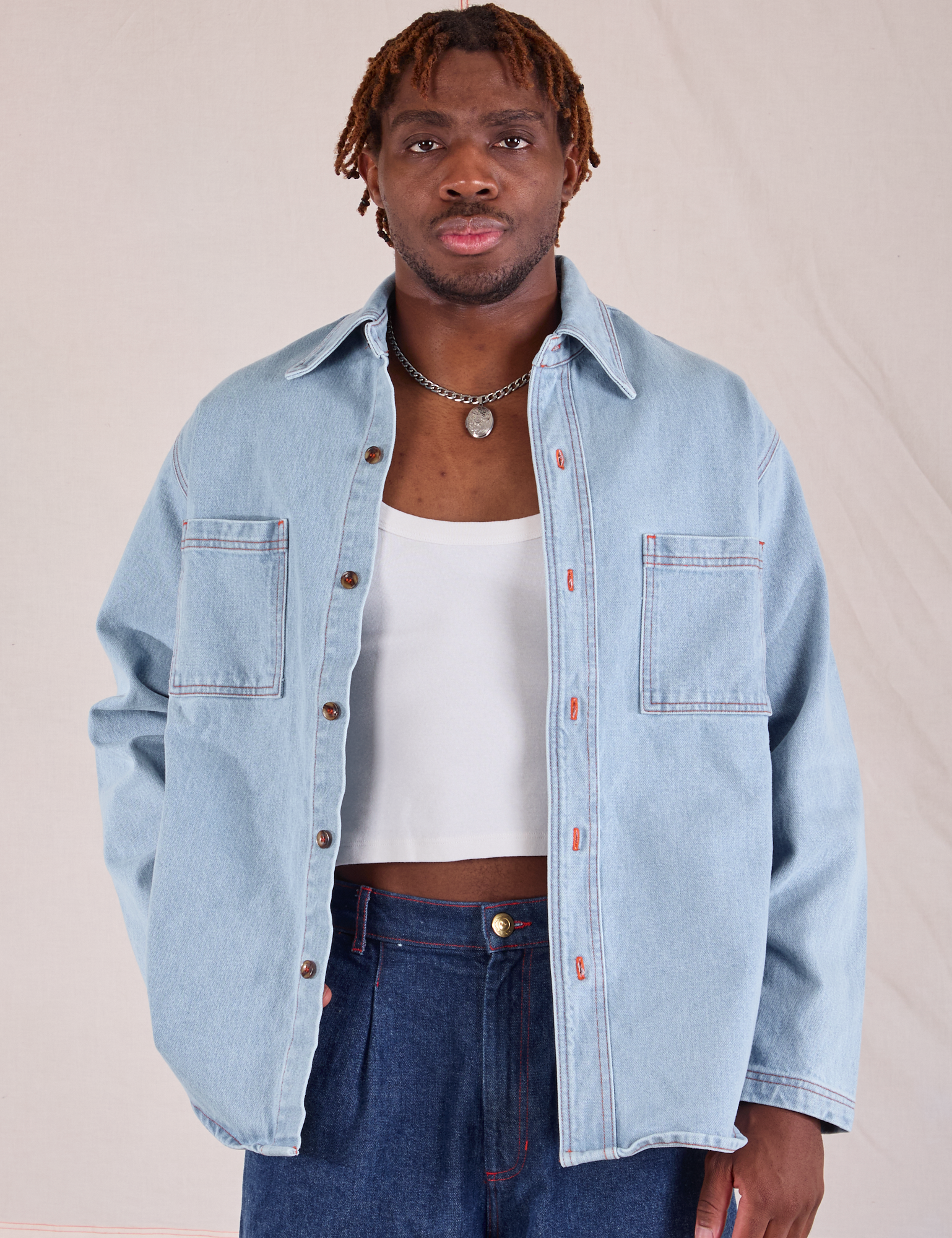 Issac is 5'10" and wearing S Denim Overshirt in Light Wash