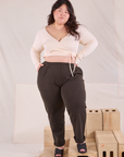 Ashley is 5'7" and wearing 0XL Easy Pants in Espresso Brown paired with vintage tee off-white Wrap Top