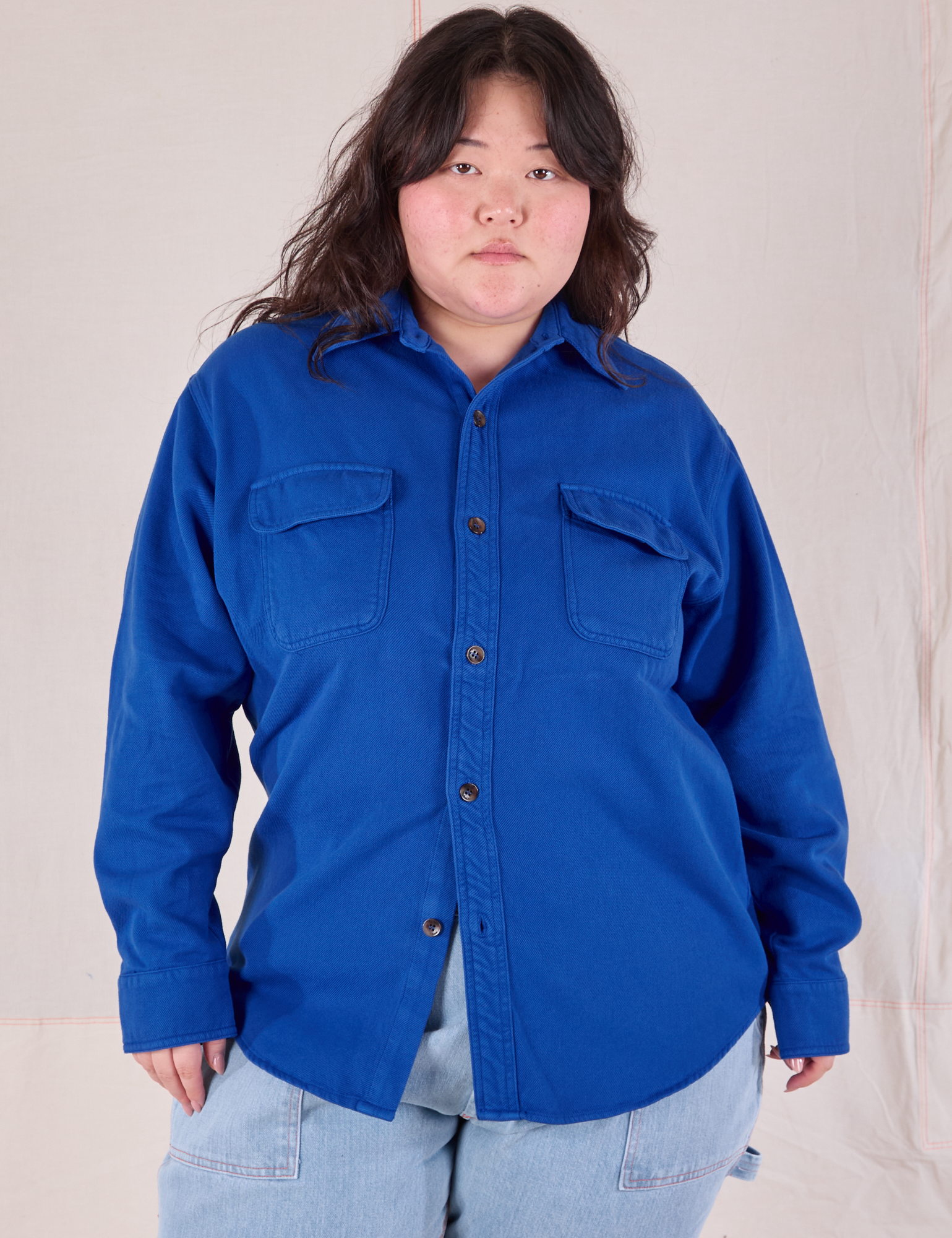 Ashley is wearing a buttoned up Flannel Overshirt in Royal Blue