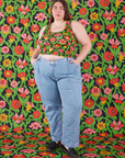 Marielena is wearing Cropped Tank in Flower Tangle and light wash Carpenter Jeans