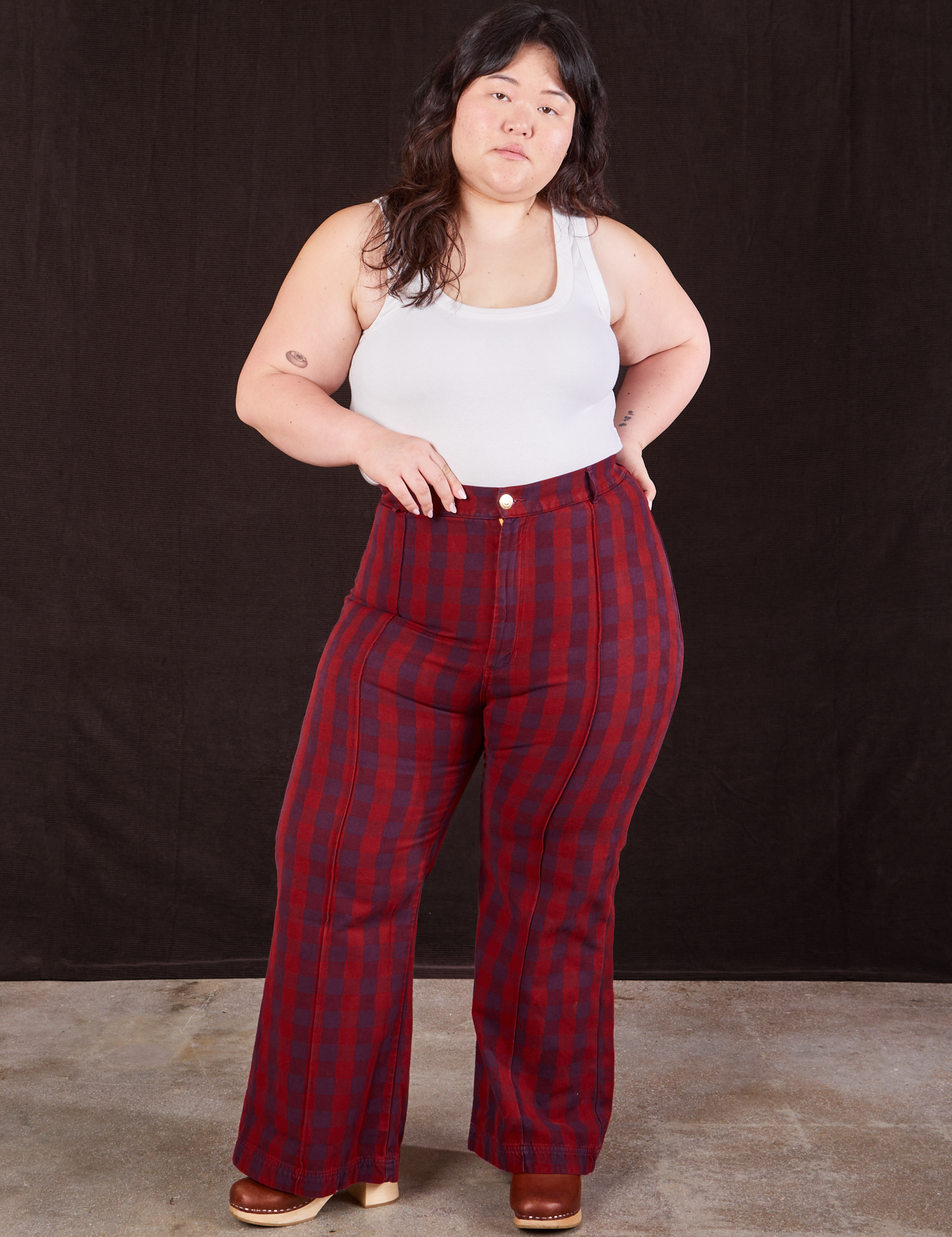Ashley is wearing Gingham Western Pants in Cranberry Red and Cropped Tank in vintage tee off-white