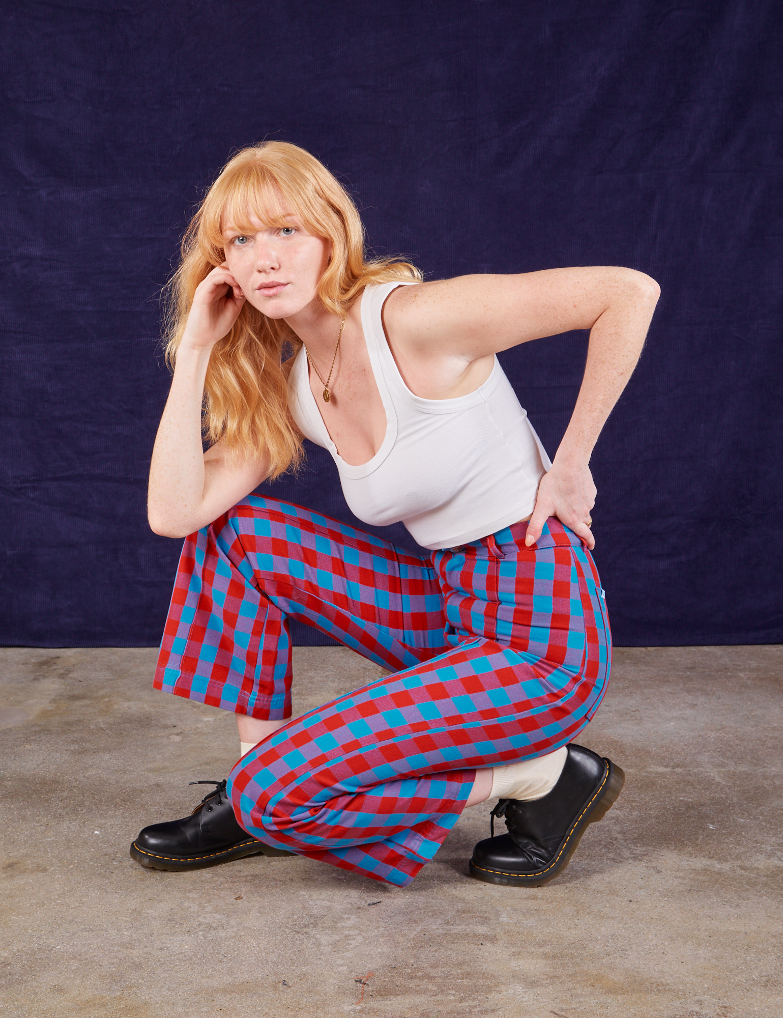 Margaret is wearing Gingham Western Pants in Blue & Red and Cropped Tank in vintage tee off-white