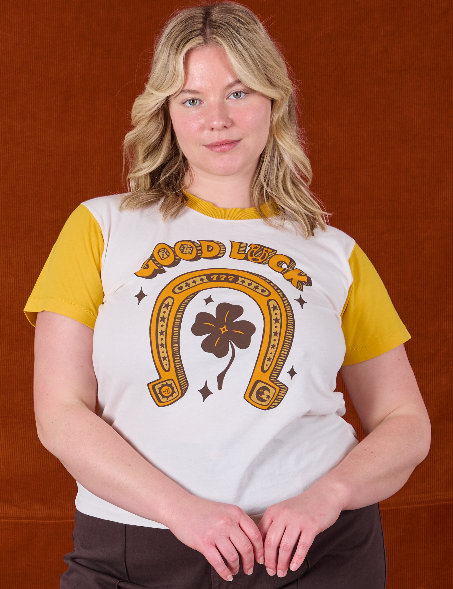 Lish is 5'8" and wearing XS Golden Horseshoe Organic Tee