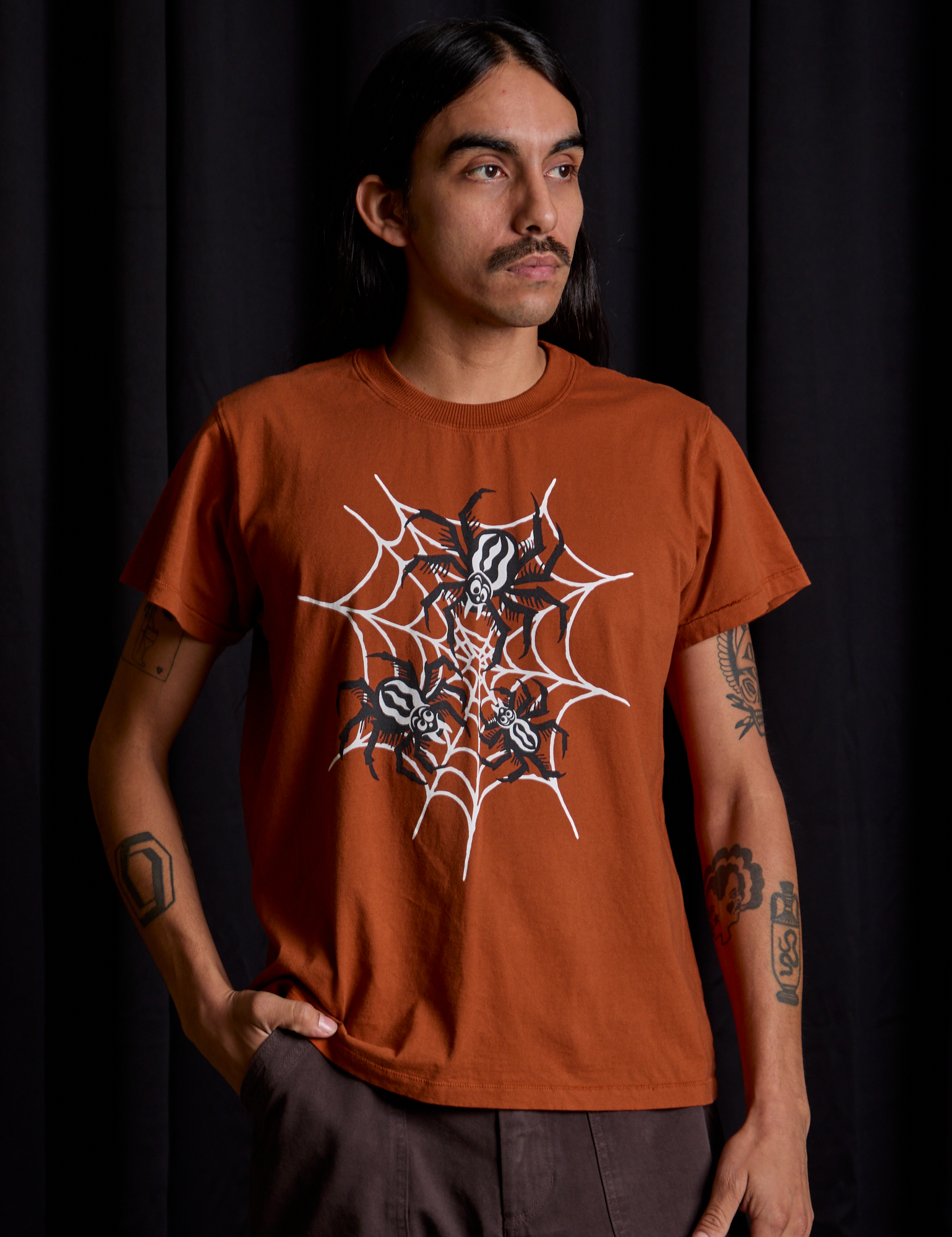 Anthony is 5'6" and wearing S Vintage Tee in Spidey