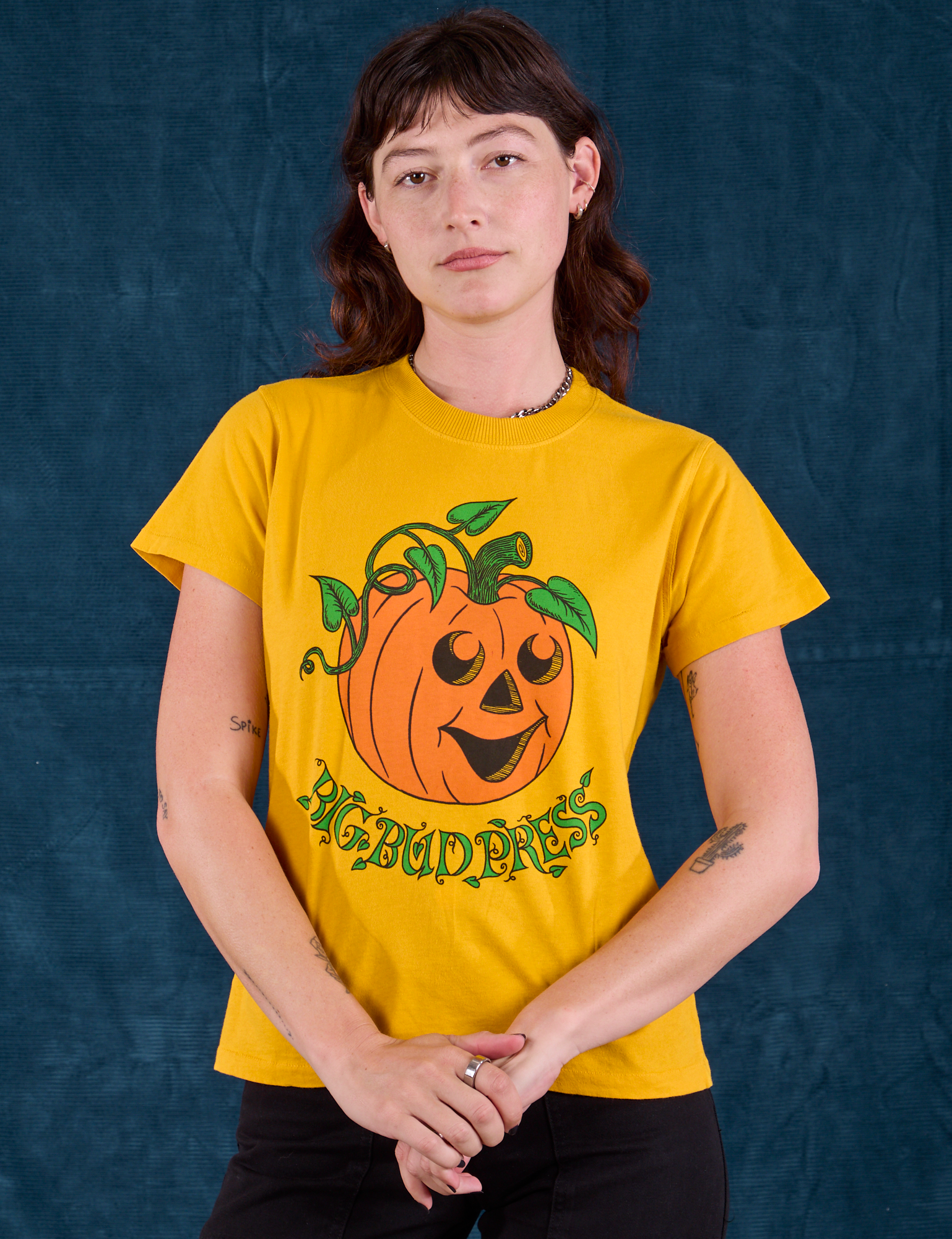 Alex is 5'8" and wearing P  Halloween Organic Tee in Pumpkin