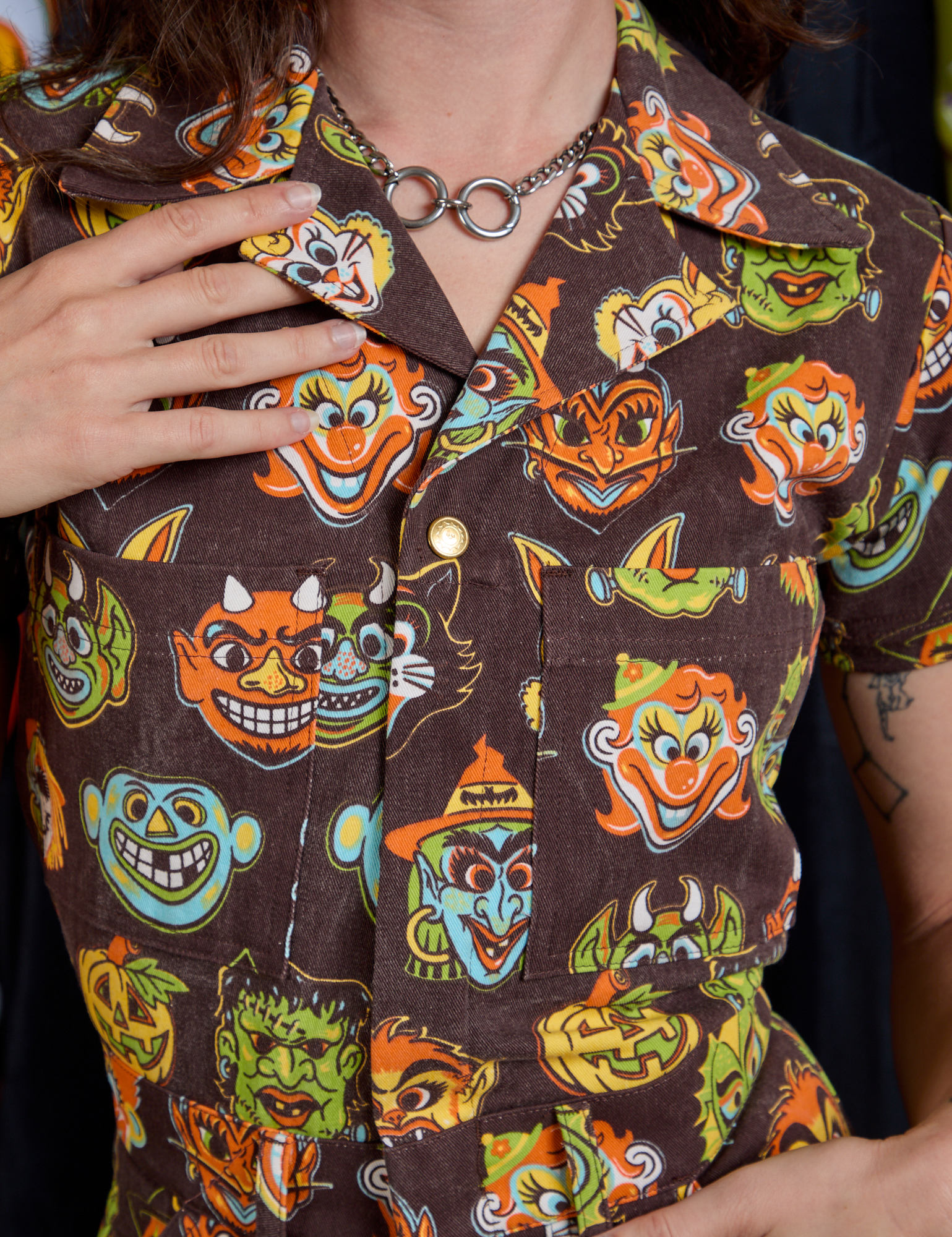 Short Sleeve Jumpsuit in Halloween Masks front close up on Alex