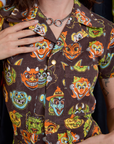 Short Sleeve Jumpsuit in Halloween Masks front close up on Alex