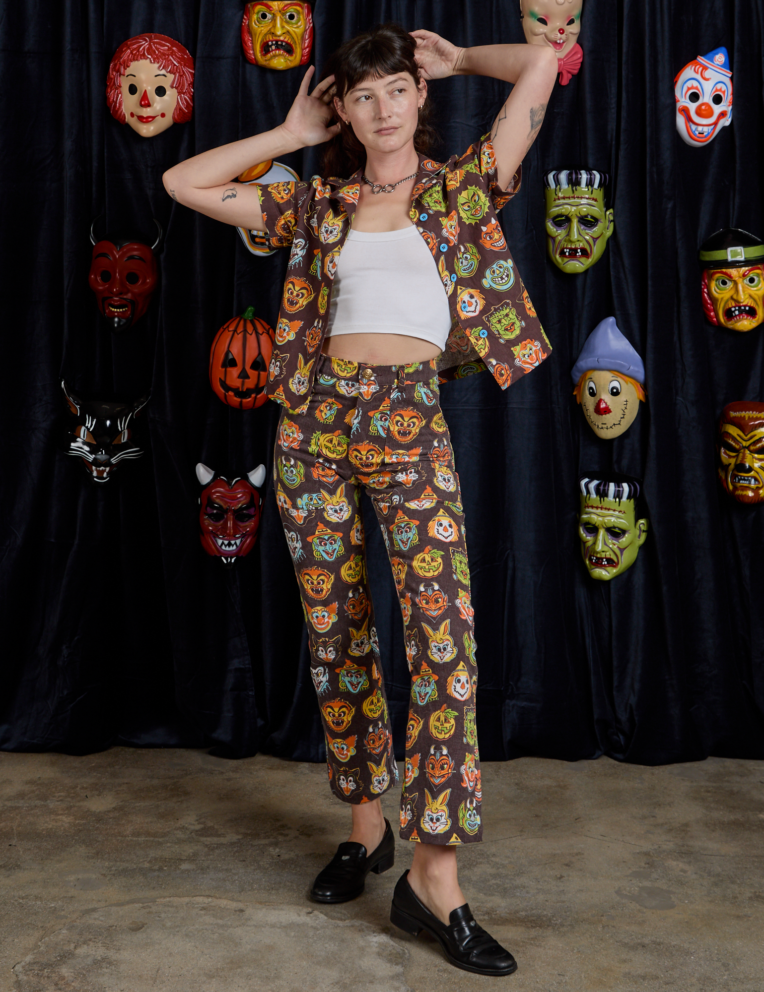Alex is wearing Halloween Masks Pantry Button-Up paired with matching Work Pants