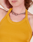 Front close up of Halter Top in Mustard Yellow worn by Alex