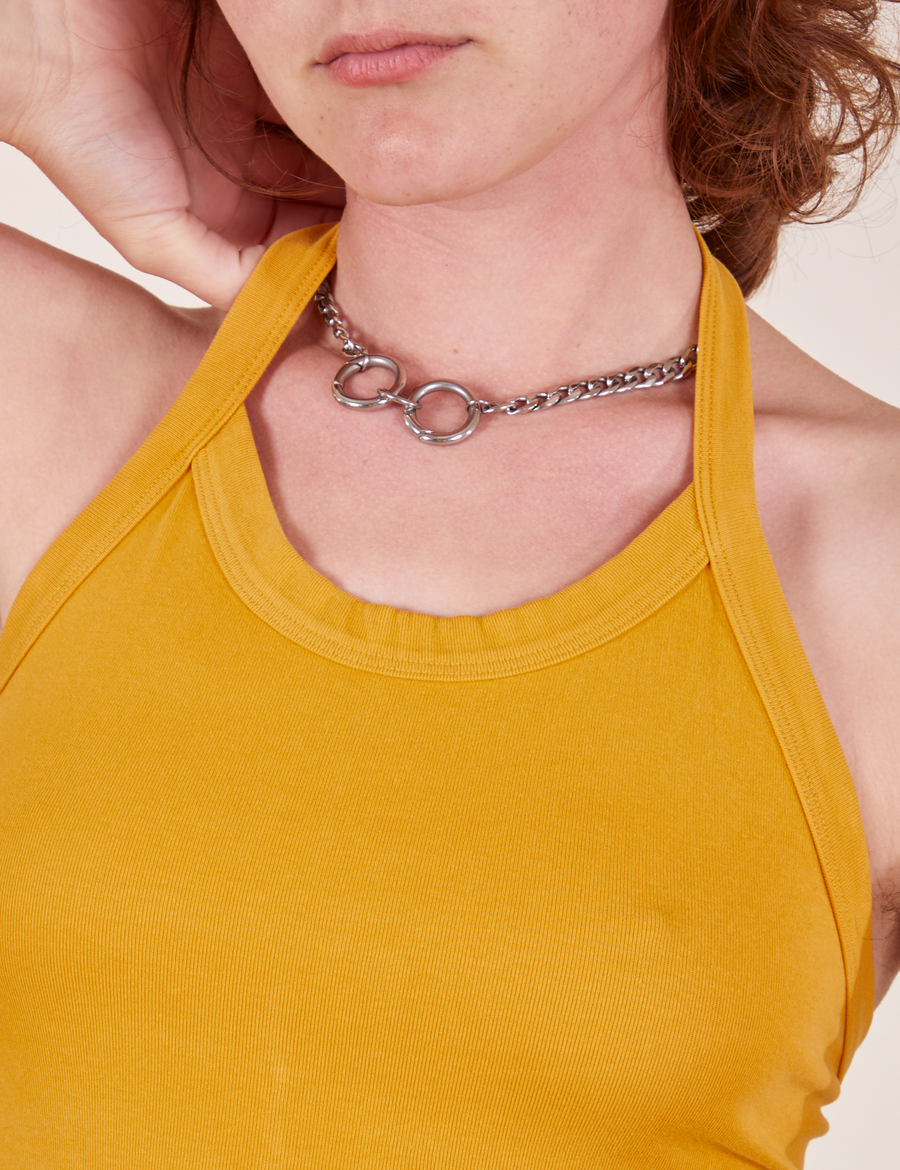 Front close up of Halter Top in Mustard Yellow worn by Alex
