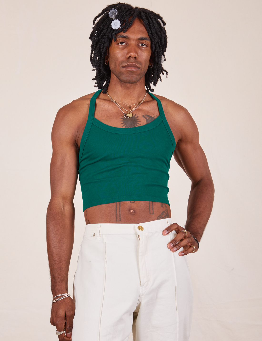 Jerrod is wearing Halter Top in Hunter Green and vintage off-white Western Pants