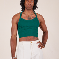 Jerrod is wearing Halter Top in Hunter Green and vintage off-white Western Pants
