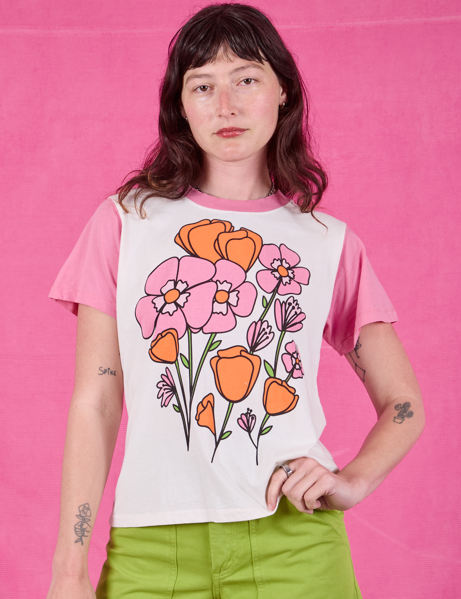 Alex is 5’8” and wearing P Anniversary Tee in Pink Poppy