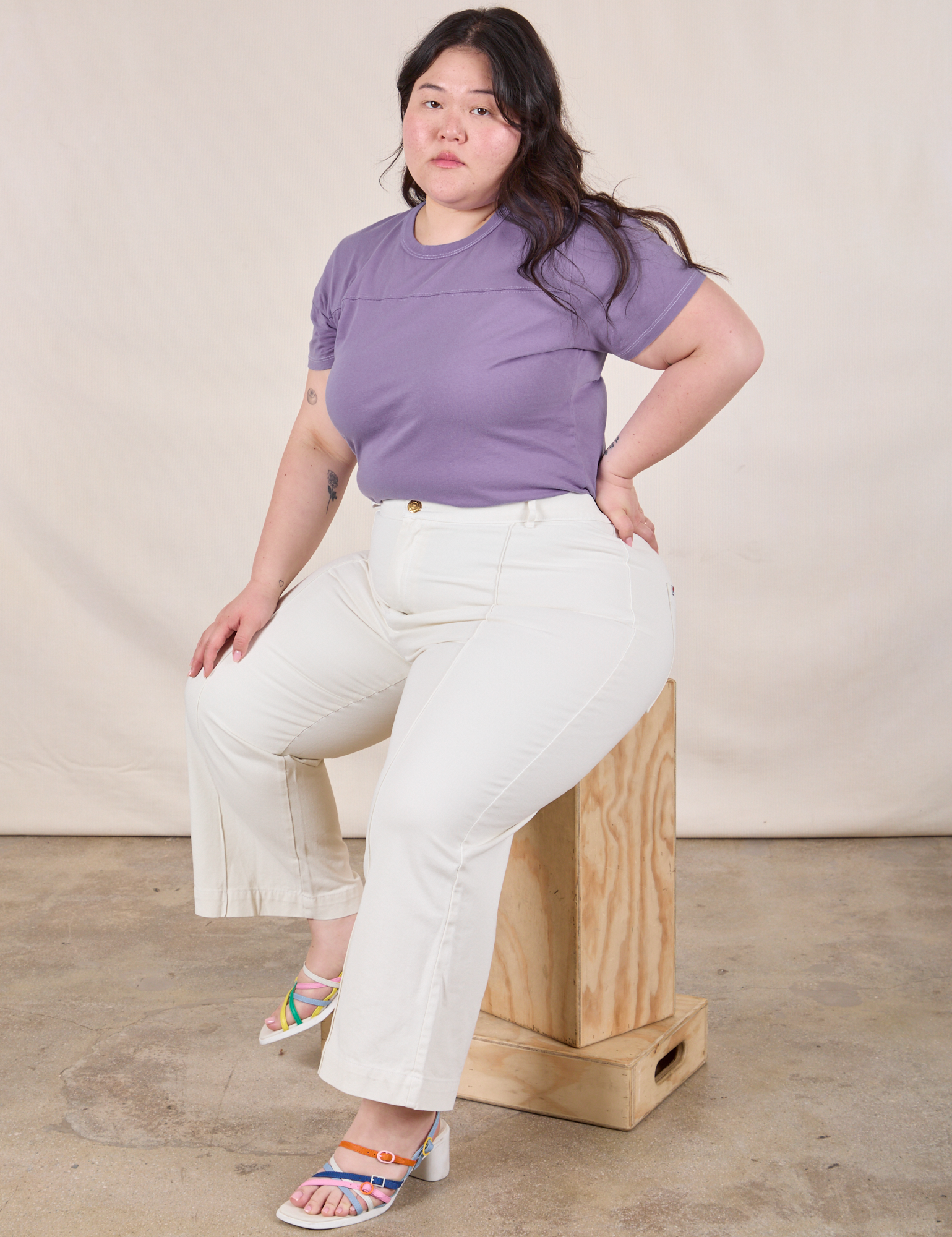 Ashley is wearing Jr. Varsity Tee in Faded Grape and vintage tee off-white Western Pants