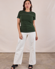 Tiara is wearing JV Tee in Swamp Green and vintage tee off-white Western Pants