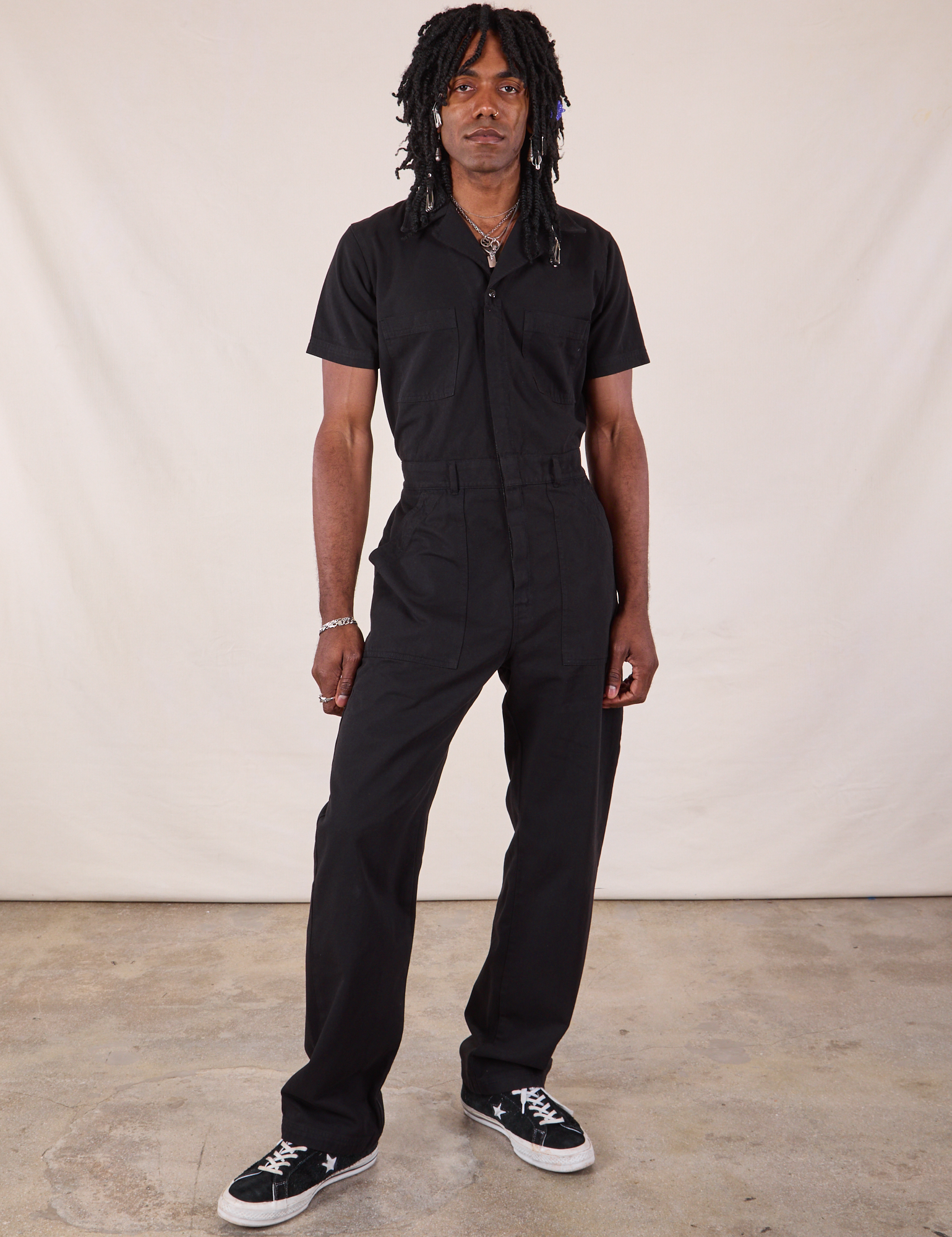 Jerrod is wearing Long Jumpsuit in Basic Black