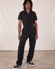 Jerrod is wearing Long Jumpsuit in Basic Black