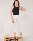 Alex is wearing Racerback Tank in Basic Black and vintage tee off-white Western Pants