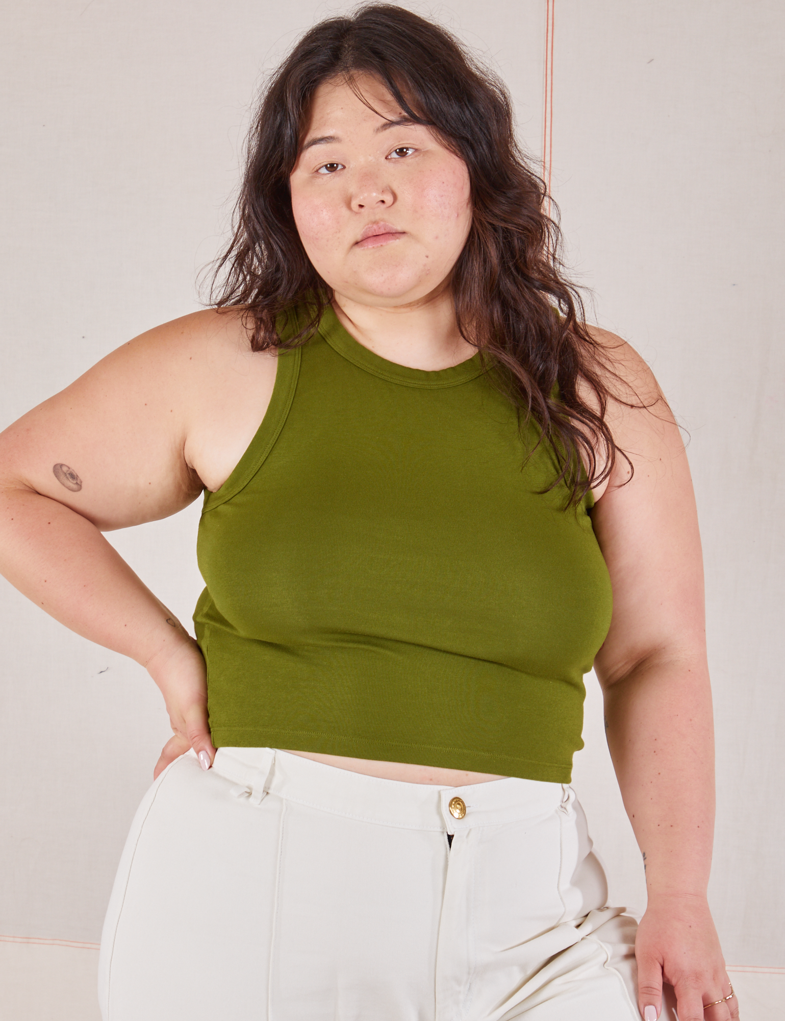 Ashley is 5’7” and wearing XL Racerback Tank in Summer Olive