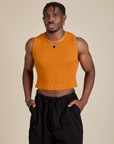 Isaac is 5’10” and wearing S Muscle Tee in Creamsicle Orange