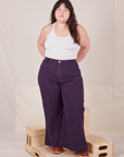 Ashley is wearing Bell Bottoms in Nebula Purple and vintage off-white Halter Top