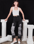 Alex is 5'8" and wearing XXS Black Venus Work Pants paired with vintage off-white Cropped Tank Top