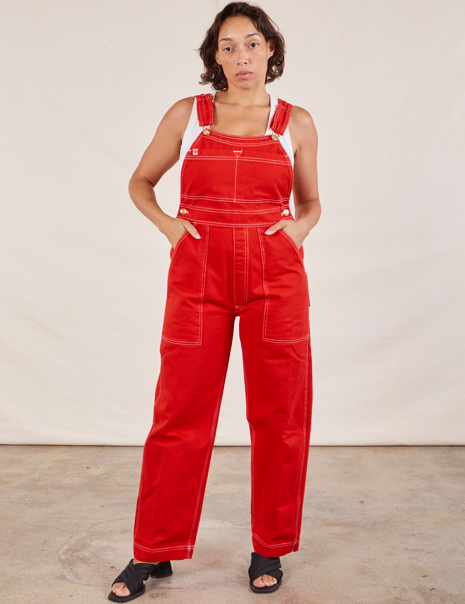 Tiara is wearing Original Overalls in Mustang Red