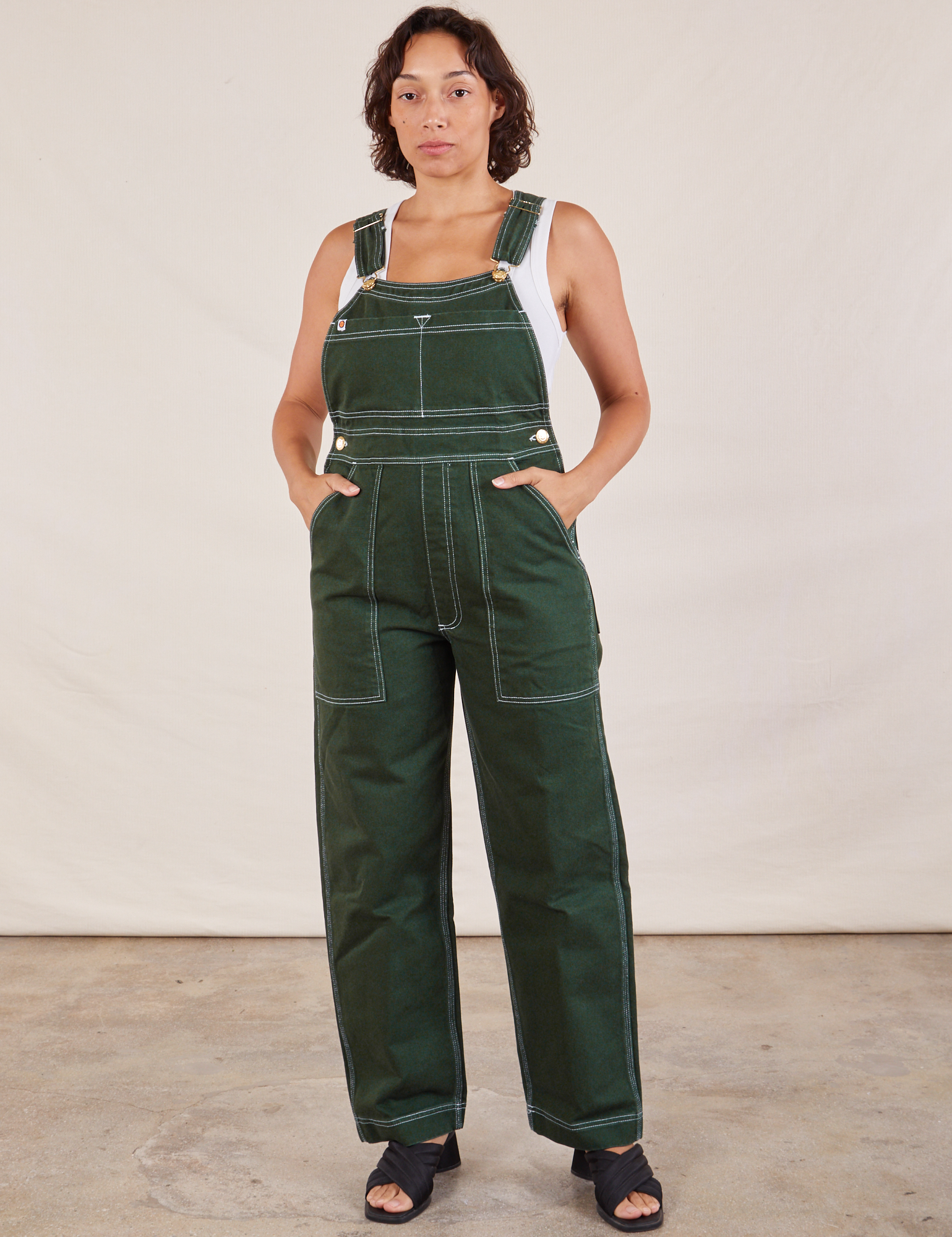 Tiara is wearing Original Overalls in Swamp Green