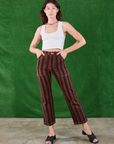 Alex is wearing Black Stripe Work Pants in Fudgesicle Brown and Cropped Tank in vintage tee off-white