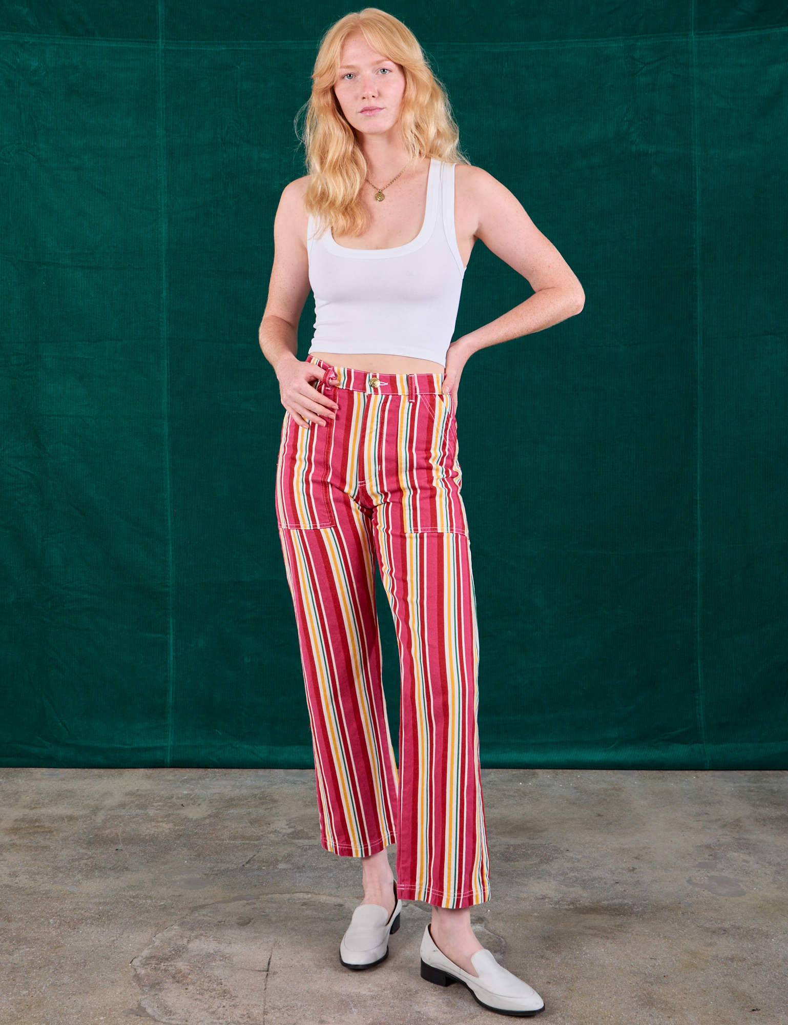 Margaret is 5'11" and wearing XS Stripe Work Pants in Cherry Candy paired with Cropped Tank in Vintage Tee Off-White