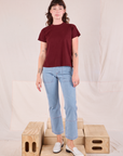 Alex is wearing Organic Vintage Tee in Red Wine and light wash Carpenter Jeans