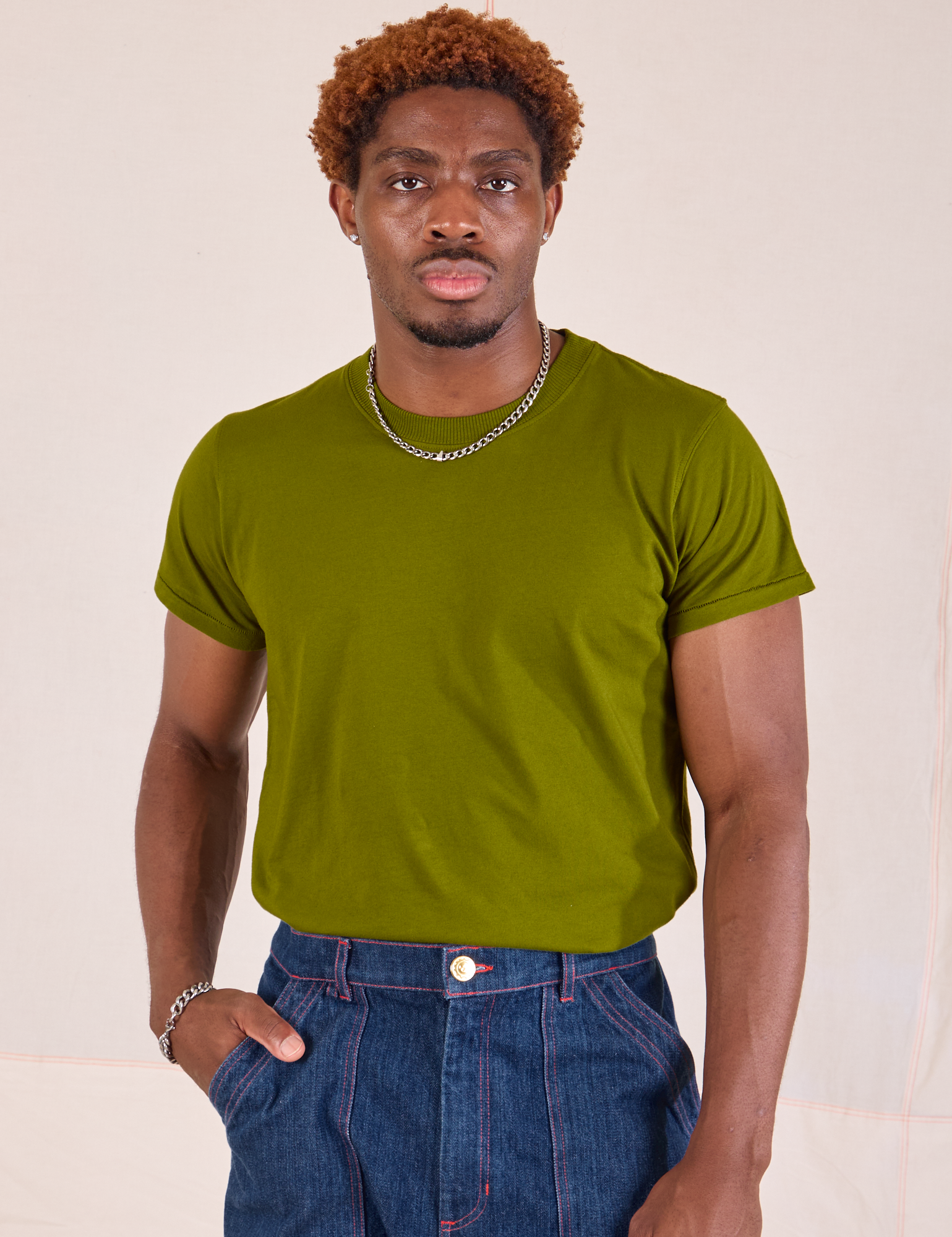 Issac is wearing Organic Vintage Tee in Summer Olive