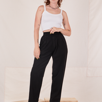 Alex is 5'8" and wearing XXS Organic Trousers in Basic Black paired with vintage off-white Cropped Cami