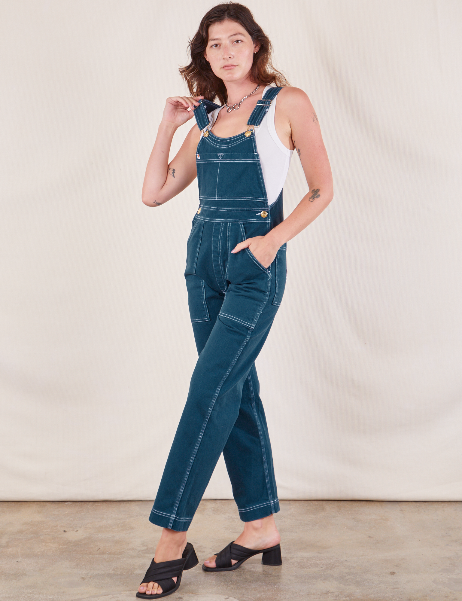 Original Overalls in Lagoon angled front view on Alex