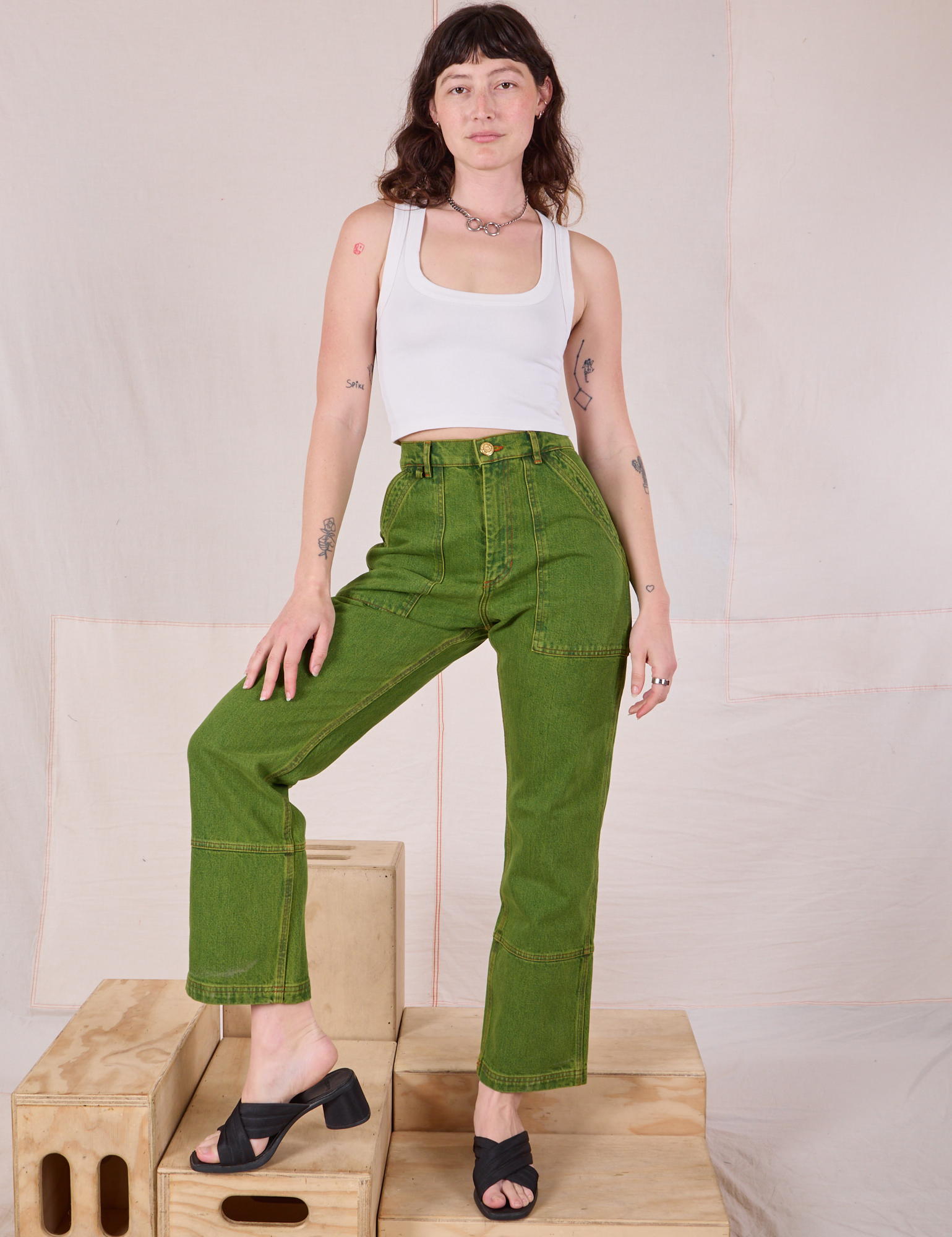 Overdyed Carpenter Jeans in Gross Green and Cropped Tank in Vintage Tee Off-White worn by Alex