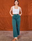 Tiara is wearing Overdye Stripe Work Pants in Blue/Green and vintage off-white Cropped Tank Top