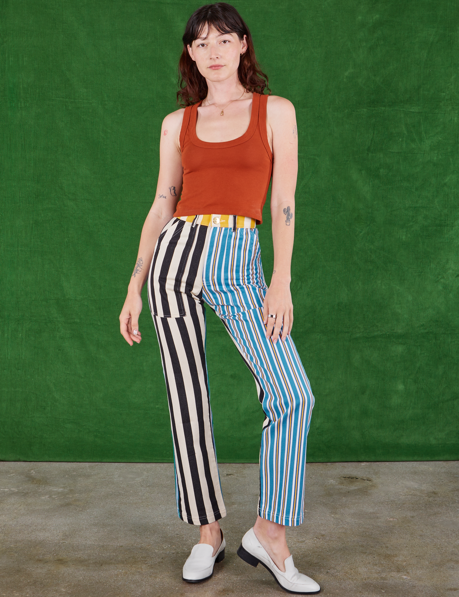 Alex is 5'8" and wearing XS Mismatched Stripe Work Pants paired with burnt terracotta Cropped Tank Top