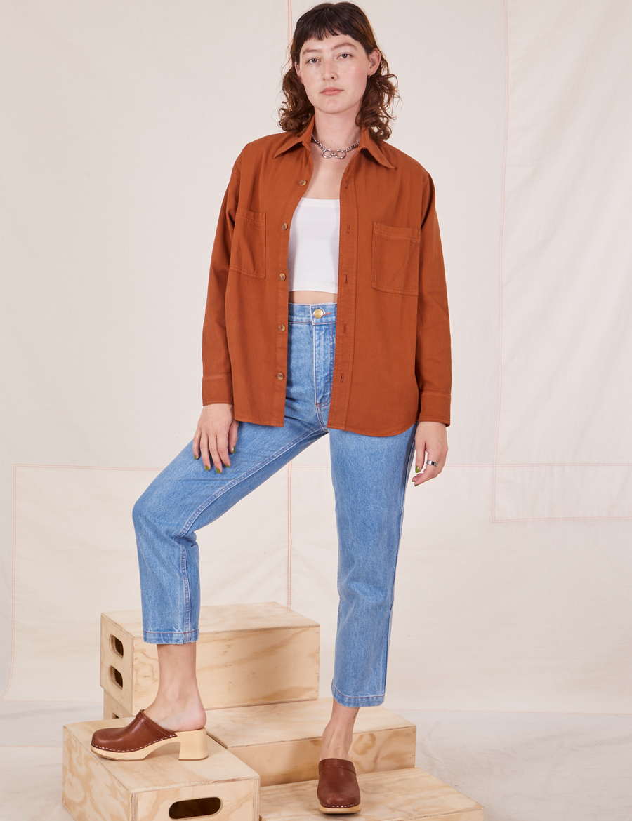 Alex is wearing Oversize Overshirt in Burnt Terracotta and vintage off-white Cropped Tank Top underneath